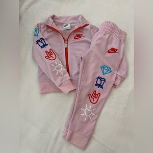 Nike Pink Tracksuit with Red and Blue Accents